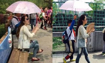 Trung Quốc: Học sinh cầm ô che nắng cho cô suốt buổi dã ngoại