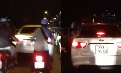 Chạy xe trên cầu Long Biên, lái xe ô tô bị cô gái chửi, quay clip
