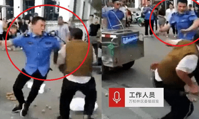 Video: Cán bộ đô thị cầm roi đánh người bán hàng rong dã man tại Trung Quốc
