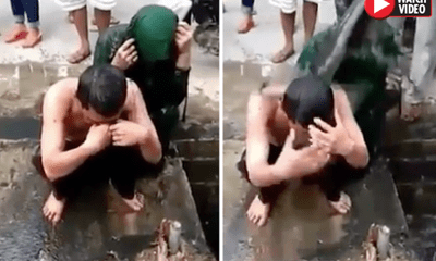 Video: Cặp đôi bị tố ngoại tình ngồi im để dân làng dội nước cống lên đầu