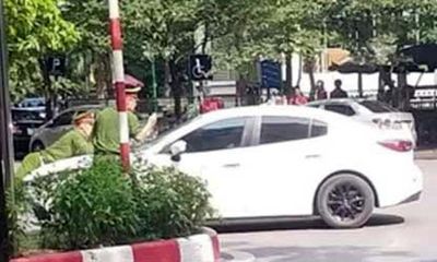 Hà Nội: Bắt tạm giam tài xế ô tô hất cảnh sát lên nắp ca pô, bỏ chạy 1 km