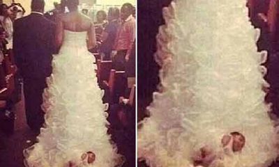 Phẫn nộ cô dâu gắn con gái sơ sinh vào đuôi váy cưới