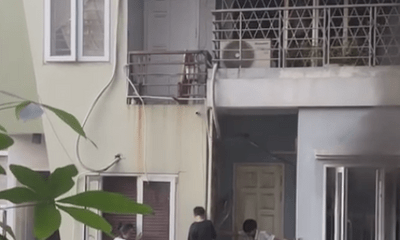 Hiện trường vụ cháy nhà lúc sáng sớm ở Hà Nội, 2 bé trai cùng gia đình leo ban công thoát thân