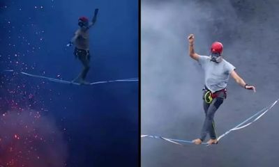 Hai người đàn ông mạo hiểm đi thăng bằng trên dây qua miệng núi lửa đang hoạt động