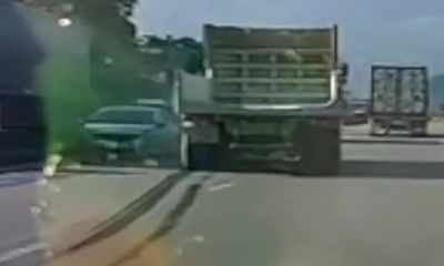 Video: Xe tải chuyển làn ẩu, húc ô tô con lao thẳng dải phân cách